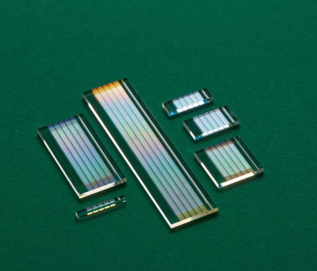 Selection of bulk crystals in varying sizes, representing Free Space MgO:PPLN Bulk Crystal Custom Solutions.